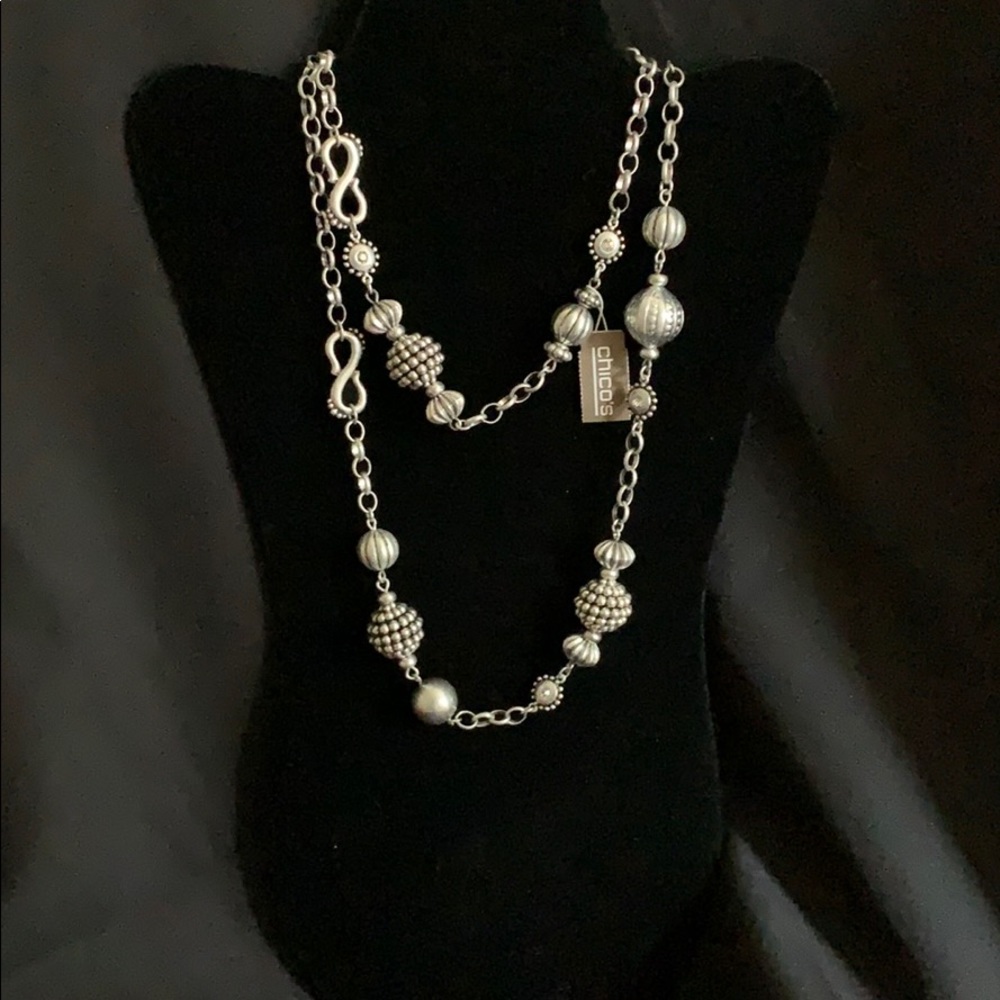 Silver antique-looks necklace.